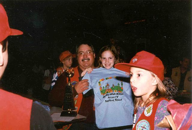 Marty and Gretchen Williams with winning T-shirt, Fiona Cary in front.jpg